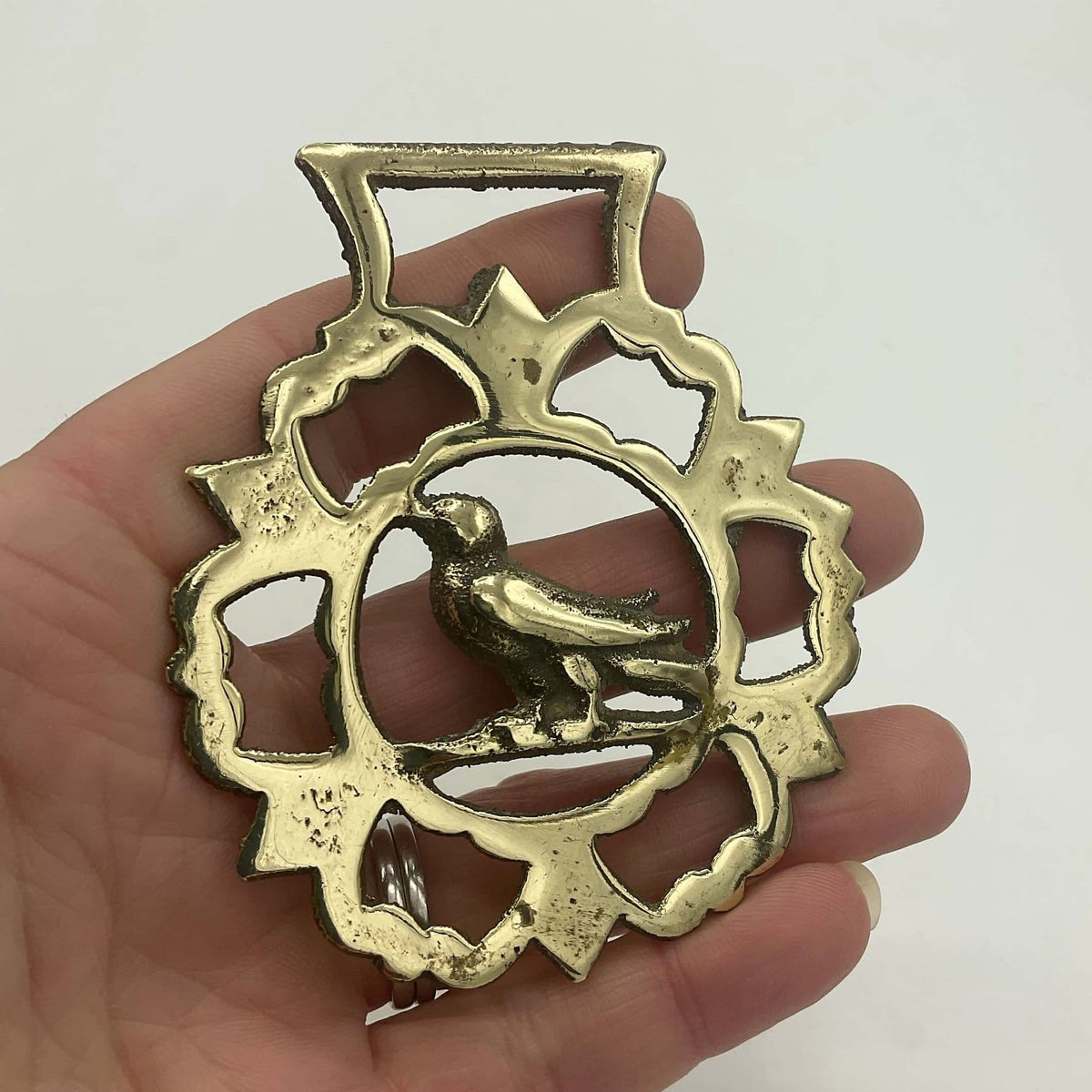 Antique Bird Horse Brass by Beeches Vintage featuring detailed brass horse with bird ornament, vintage decorative wall accessory.