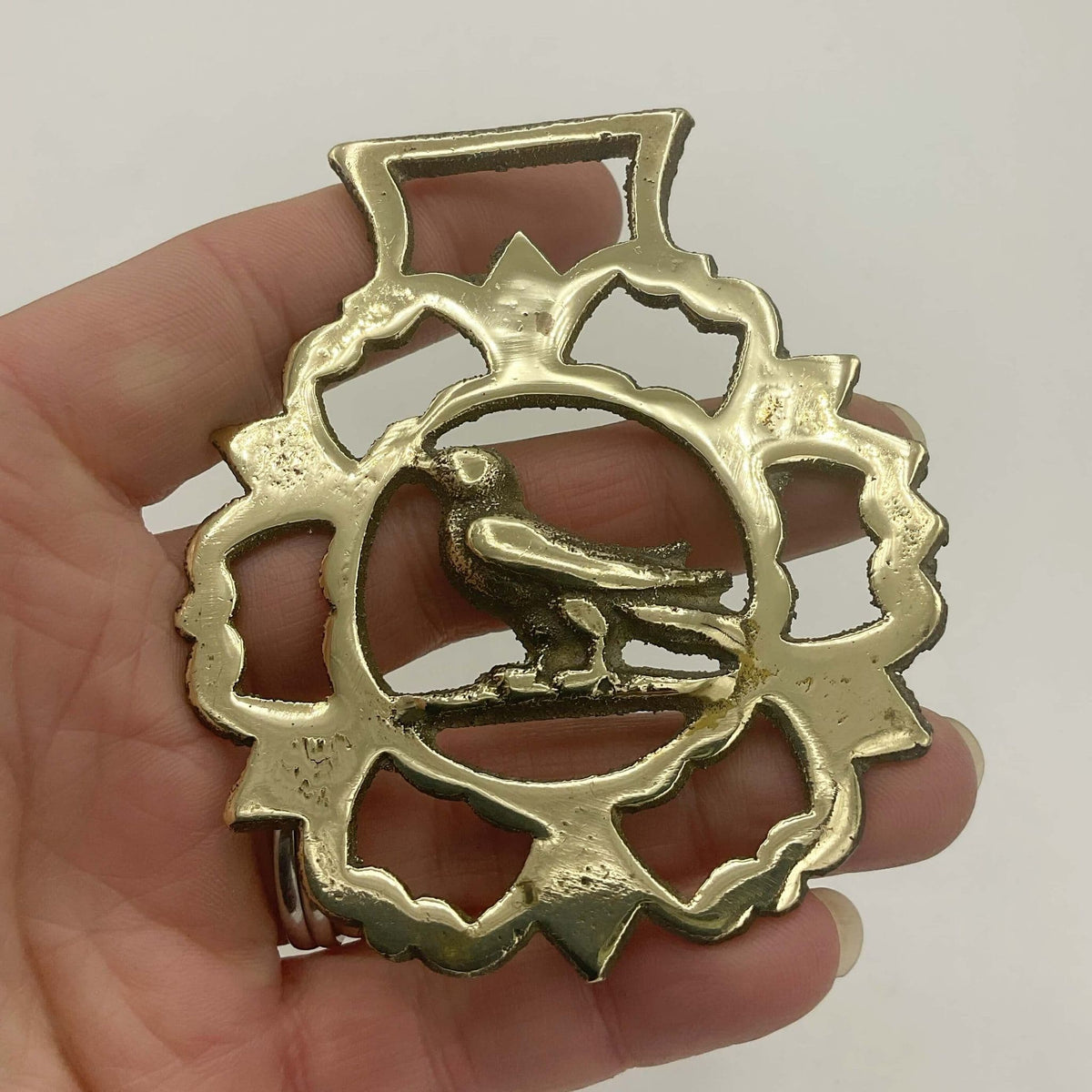 Antique Bird Horse Brass by Beeches Vintage showing a decorative brass horse ornament with bird motifs in a vintage style.