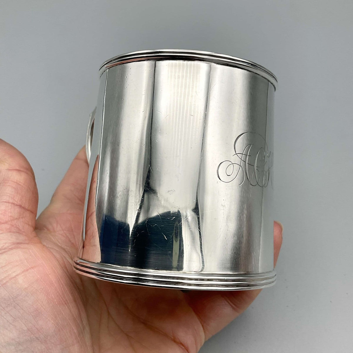 Antique Edwardian silver Christening Cup hallmarked 1907, ornate design with detailed craftsmanship, vintage religious ceremonial vessel.