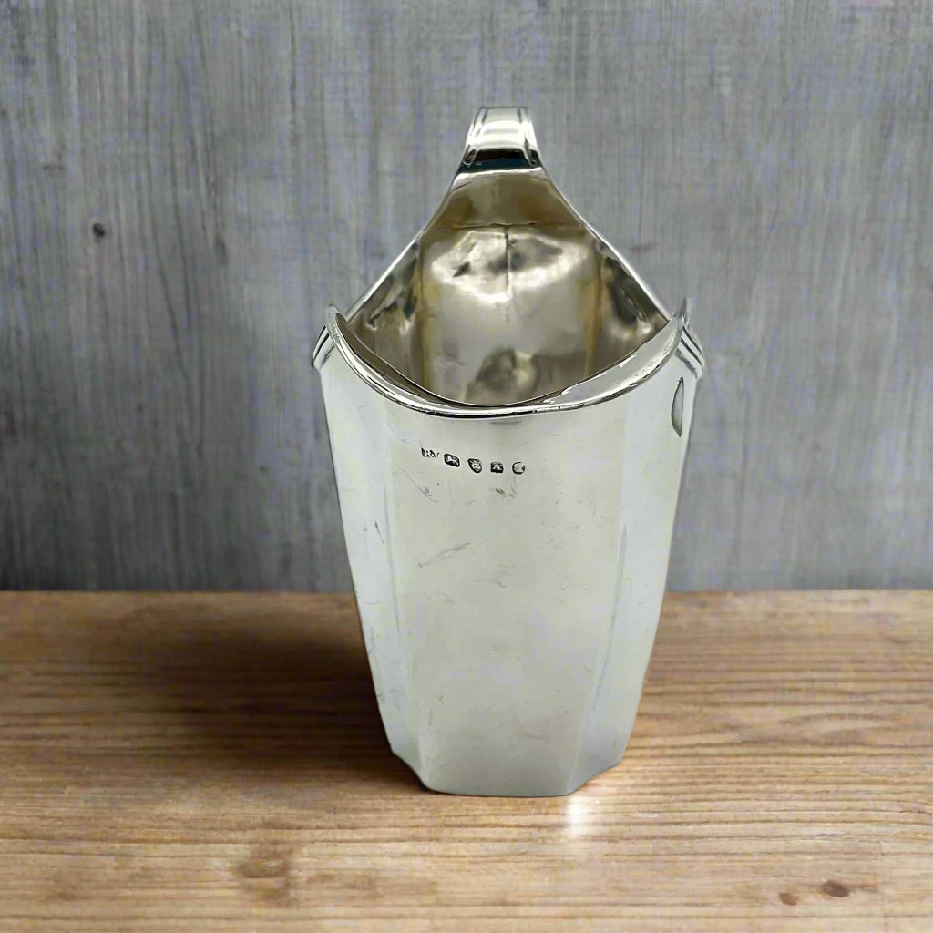 Silver jug on a wooden table
