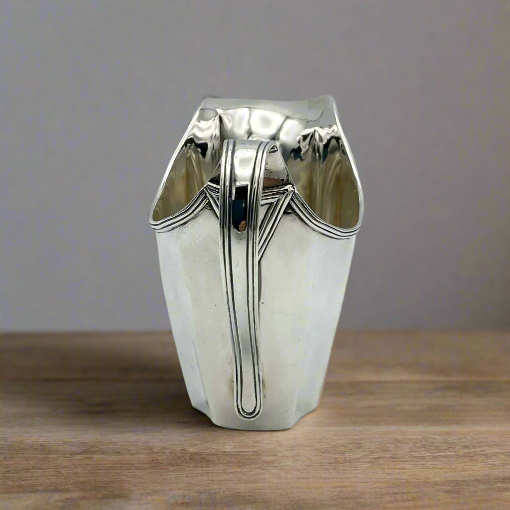 Silver jug on a wooden table