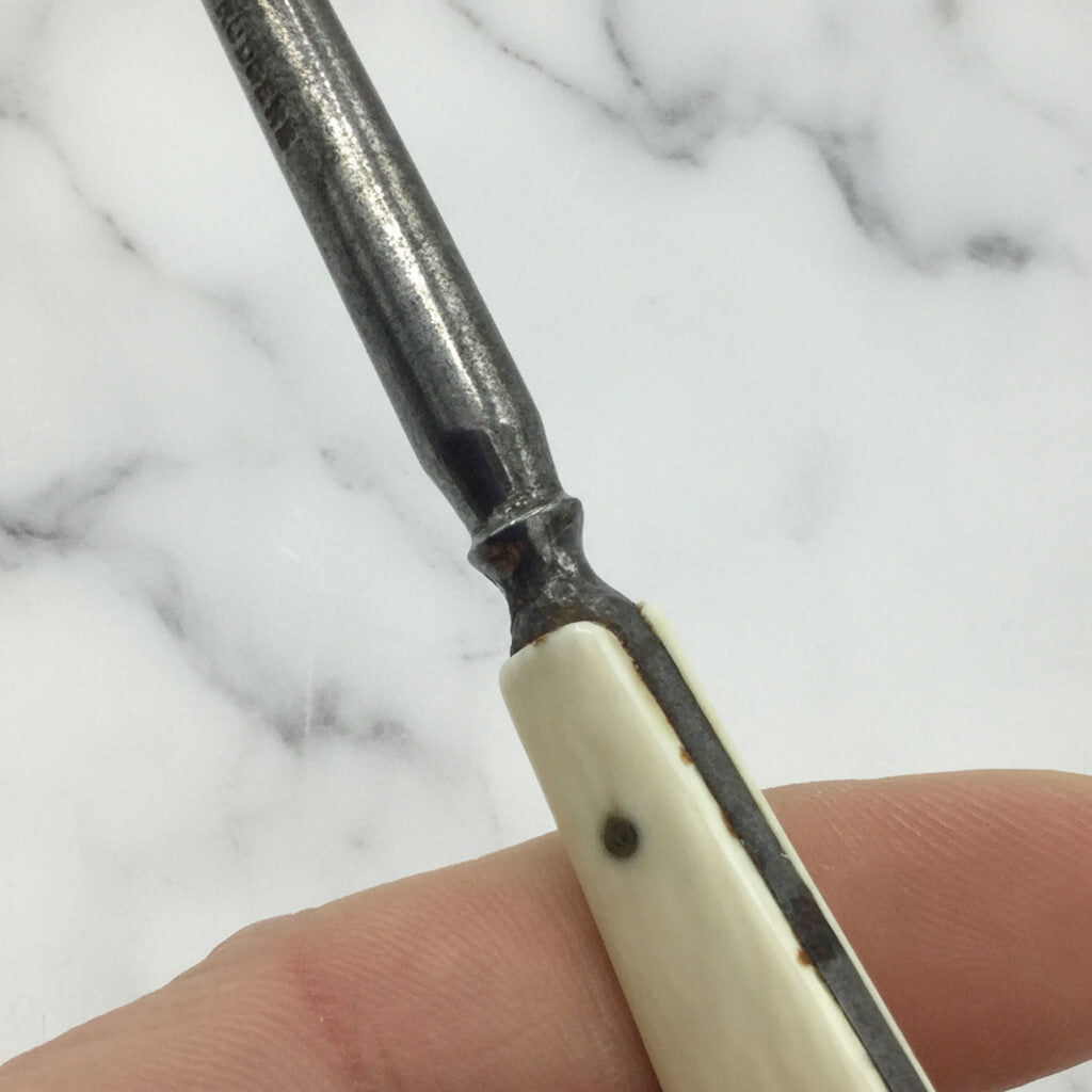 collar of bone handle attached to steel hook