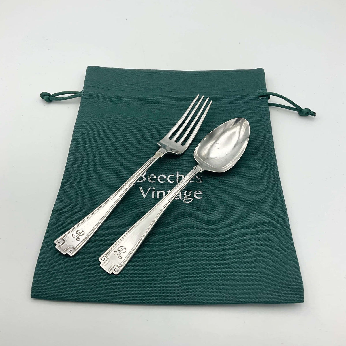 Antique small silver spoon and fork set by Beeches Vintage, perfect as a christening gift, with intricate vintage detailing.