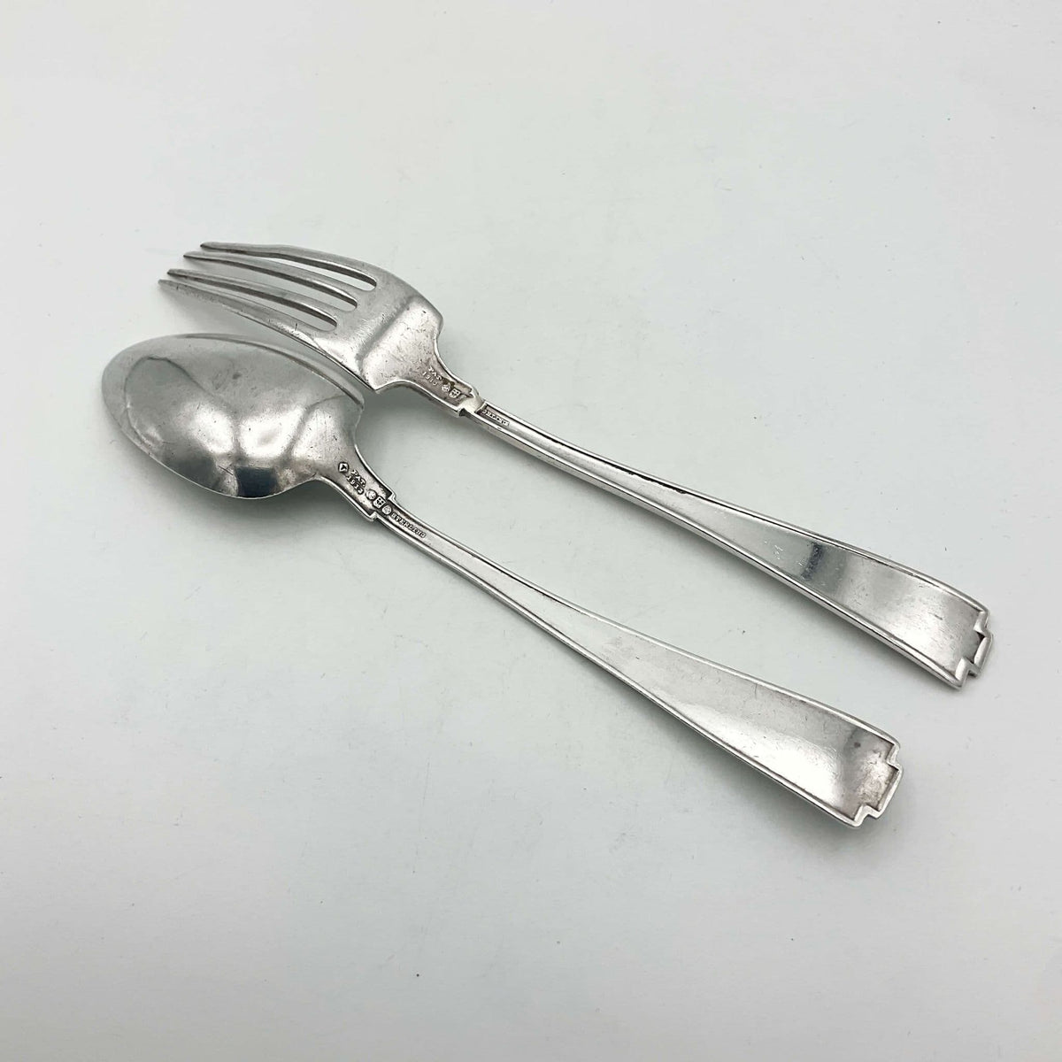 Antique small silver spoon and fork set by Beeches Vintage, ideal as a christening gift, with intricate vintage detailing.