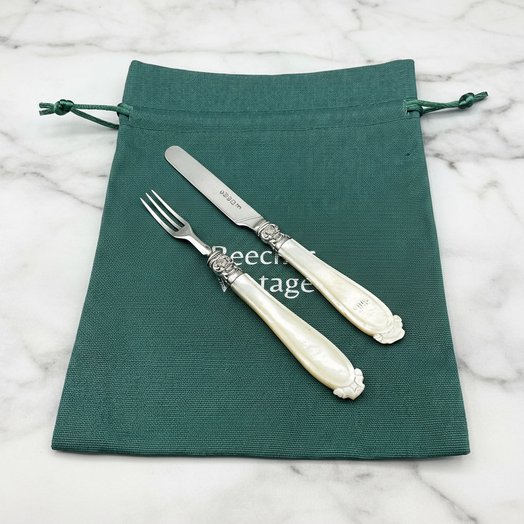 Cutlery on green bag and marble worktop