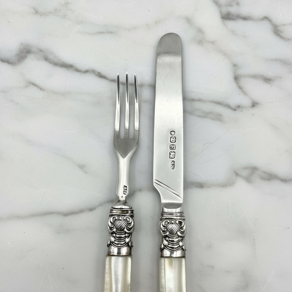 silver cutlery on a marble worktop