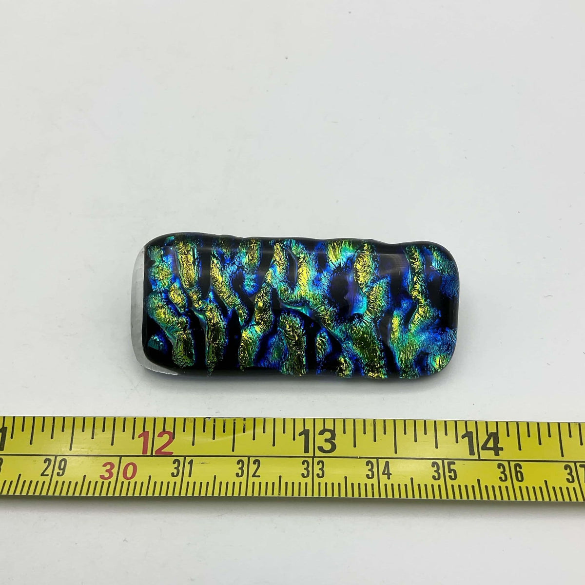 Blue and yellow glass brooch by Beeches Vintage, featuring vibrant color glass design on a decorative pin.