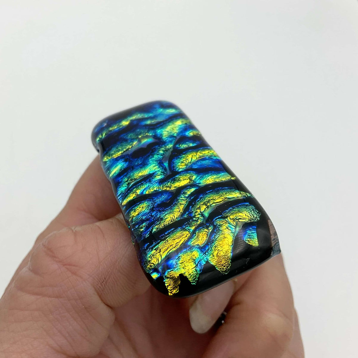 Blue and yellow glass brooch by Beeches Vintage featuring vibrant, colorful glass design with intricate craftsmanship.