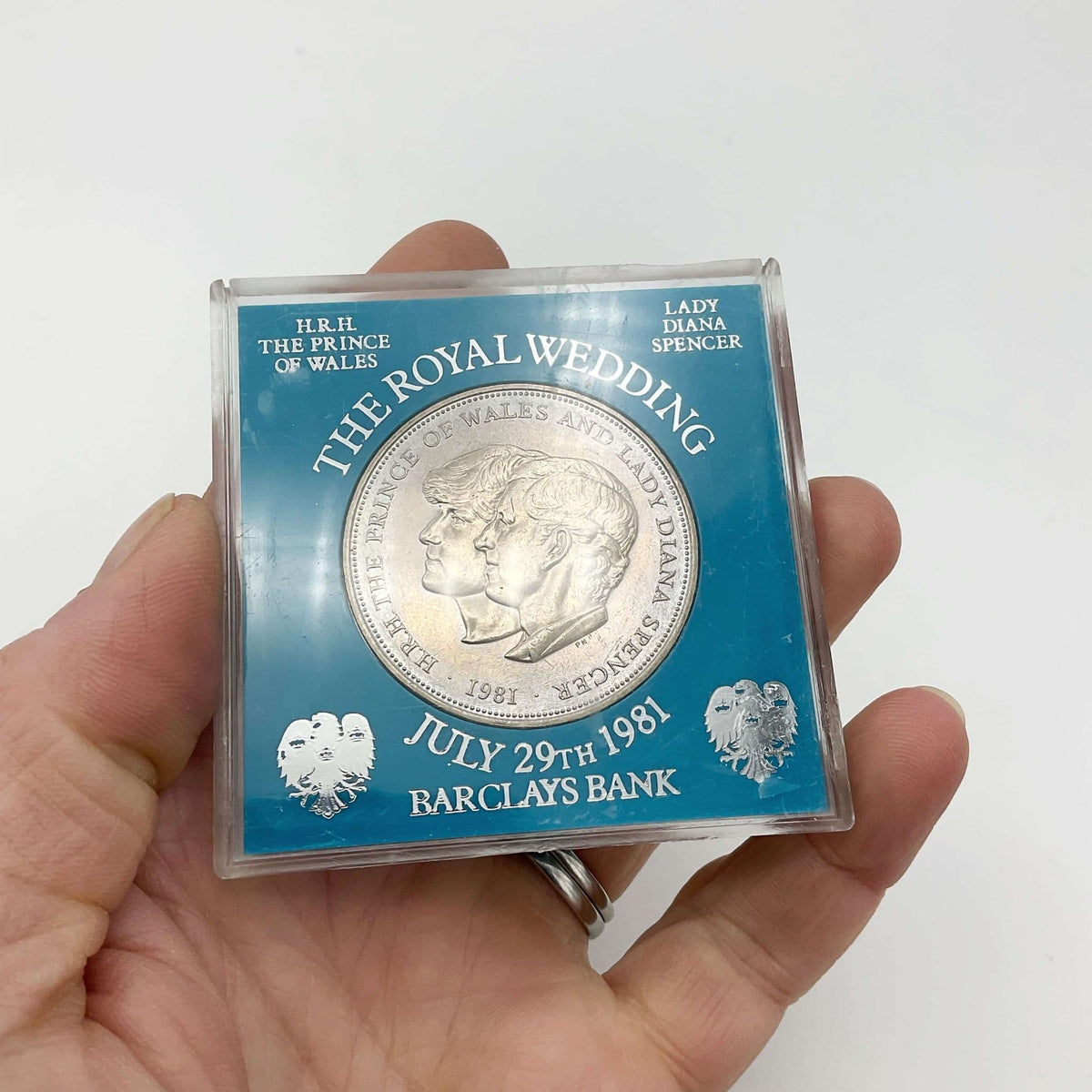 Charles & Diana 1981 Royal Wedding Coin by Beeches Vintage, showing detailed images of the commemorative coin featuring the royal couple.