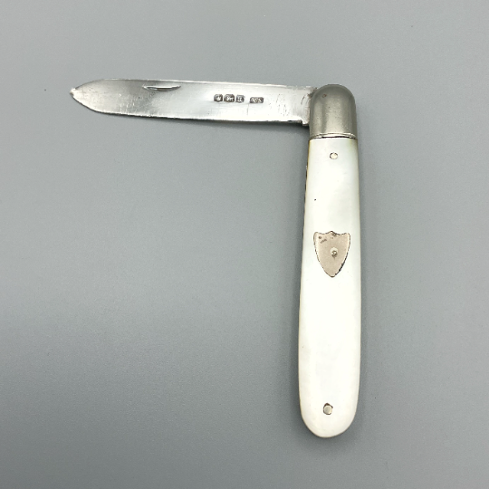 Antique Beeches Vintage sterling silver fruit knife with pearl handle and 1918 hallmark, detailed close-up of blade and handle design.