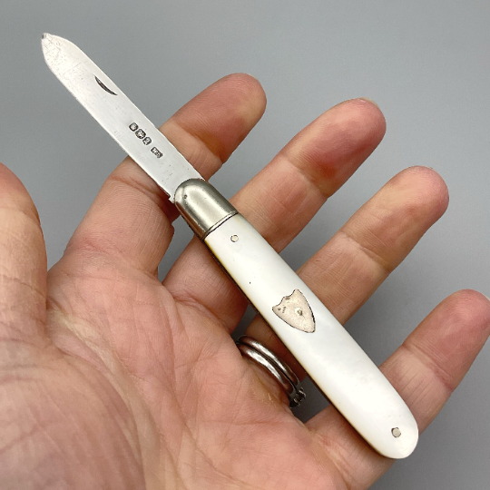 Antique Beeches Vintage sterling silver fruit knife with pearl handle and 1918 hallmark, detailed close-up of the vintage cutlery.