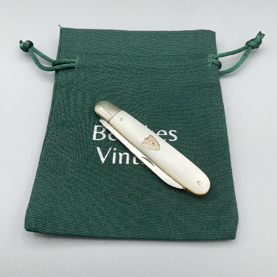 Antique Beeches Vintage sterling silver fruit knife with pearl handle and 1918 hallmark, detailed blade and elegant vintage design.