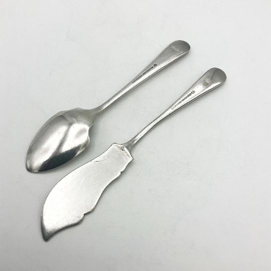 Beeches Vintage 1930s Mappin & Webb butter knife and jam spoon set with ornate silver handles and detailed craftsmanship.