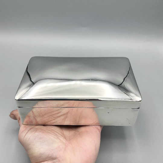 Antique 1892 Victorian sterling silver box with intricate engravings, showcasing detailed craftsmanship and vintage elegance.
