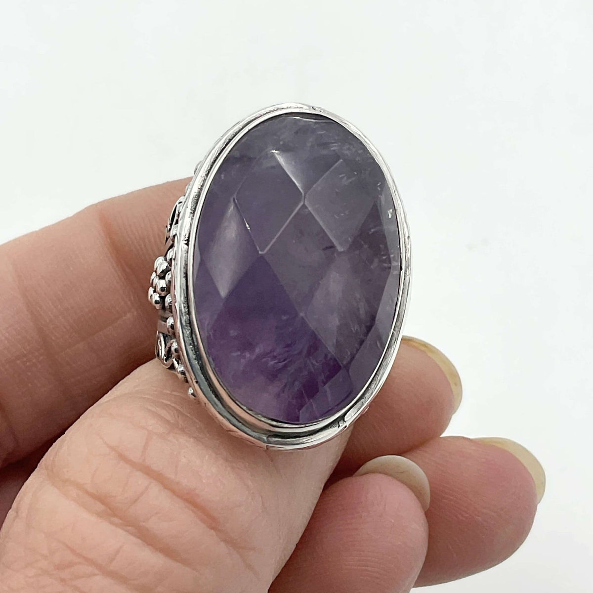 Large purple amethyst sterling silver ring featuring a prominent purple gemstone, crafted by Beeches Vintage.