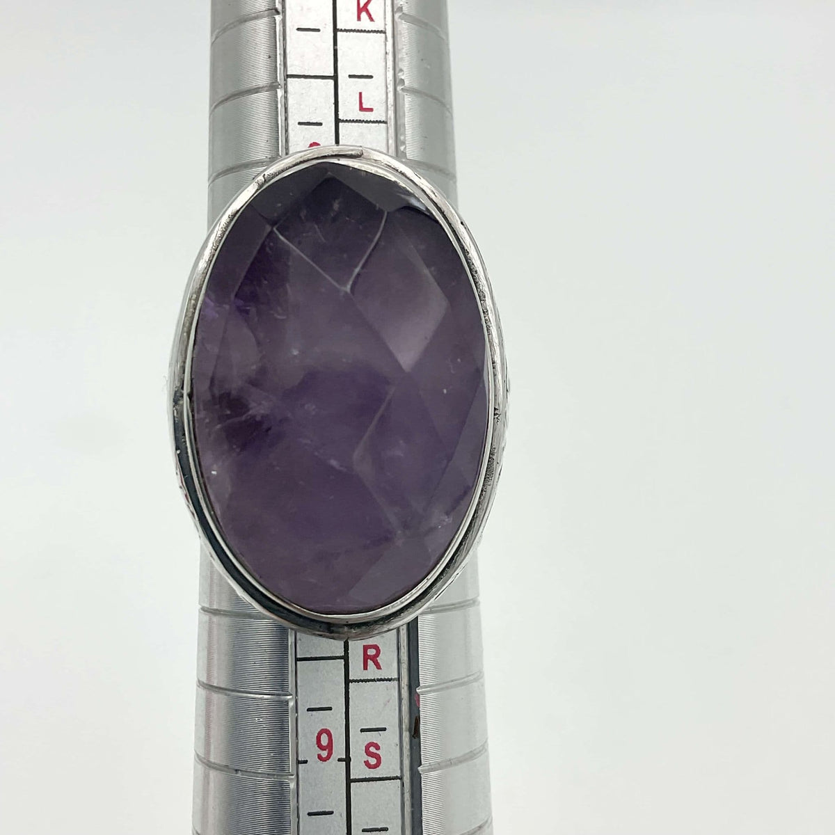 Large purple amethyst sterling silver ring featuring intricate band design, crafted by Beeches Vintage.