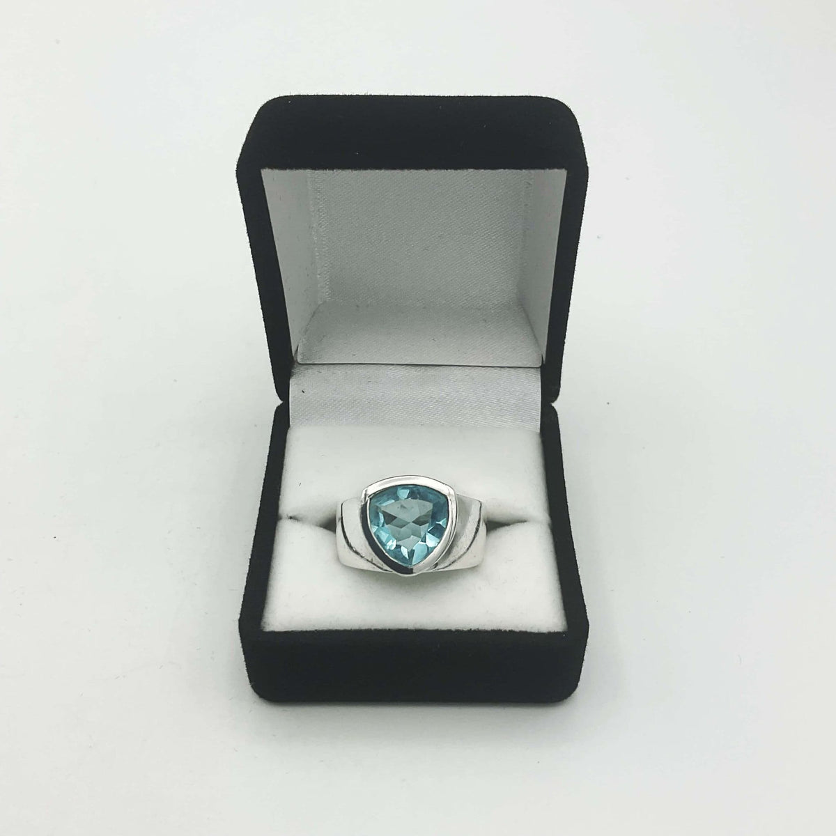 Light blue topaz aquamarine silver ring by Beeches Vintage, showing the detailed band and vibrant gemstone setting.