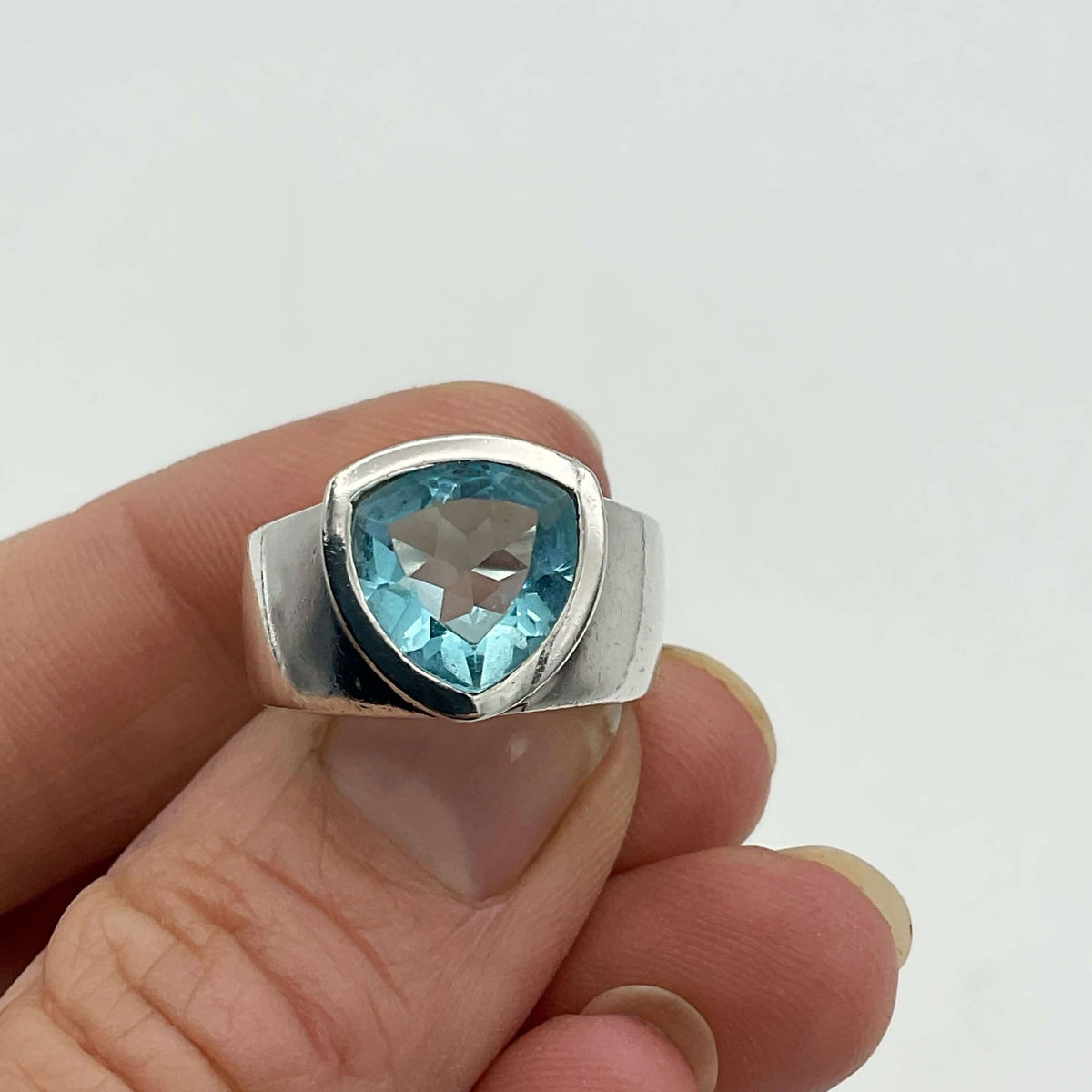 Light blue topaz silver ring by Beeches Vintage featuring a polished band and a prominent aquamarine gemstone.