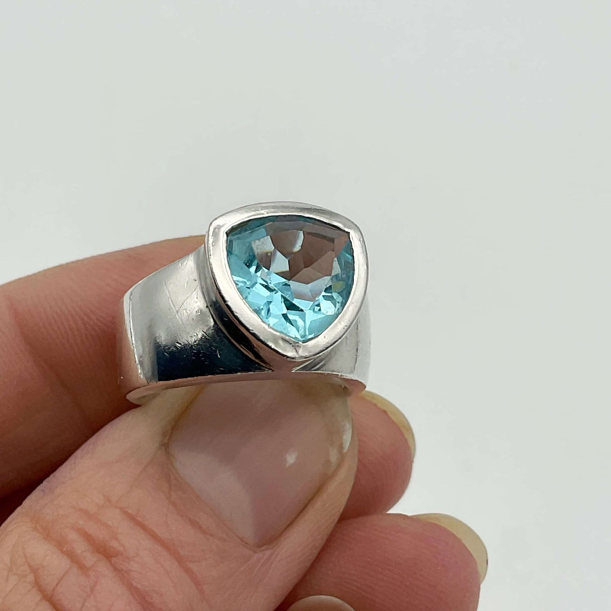 Light-blue topaz silver ring by Beeches Vintage featuring an aquamarine gemstone set in a sleek silver band.