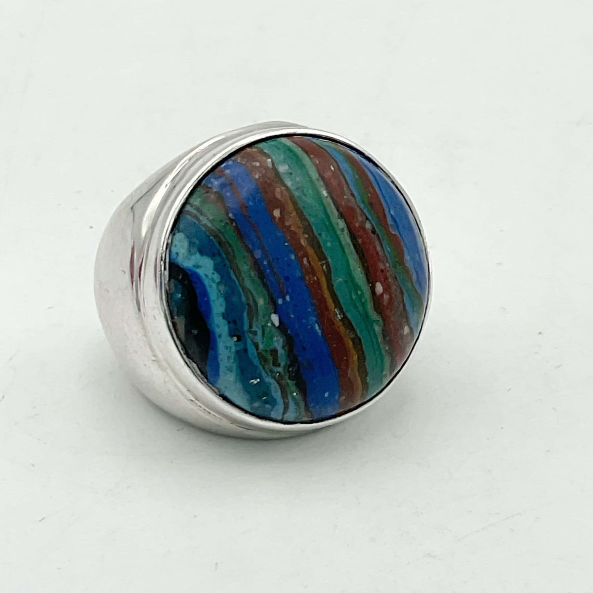 Multicoloured Rainbow Calsilica silver ring featuring vibrant rainbow hues and a polished silver band, crafted by Beeches Vintage.