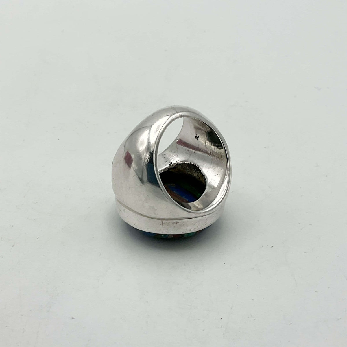 Multicoloured Rainbow Calsilica silver ring with vibrant, swirling rainbow patterns, set in a polished silver band.