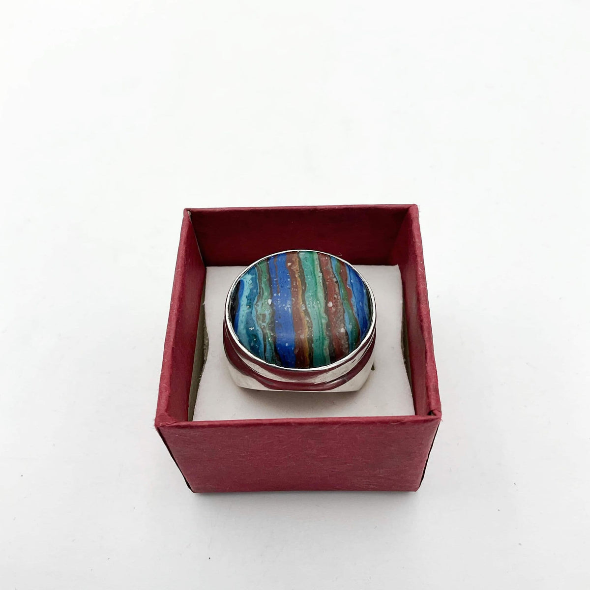 Multicoloured Rainbow Calsilica silver ring featuring vibrant rainbow hues and polished silver band, crafted by Beeches Vintage.