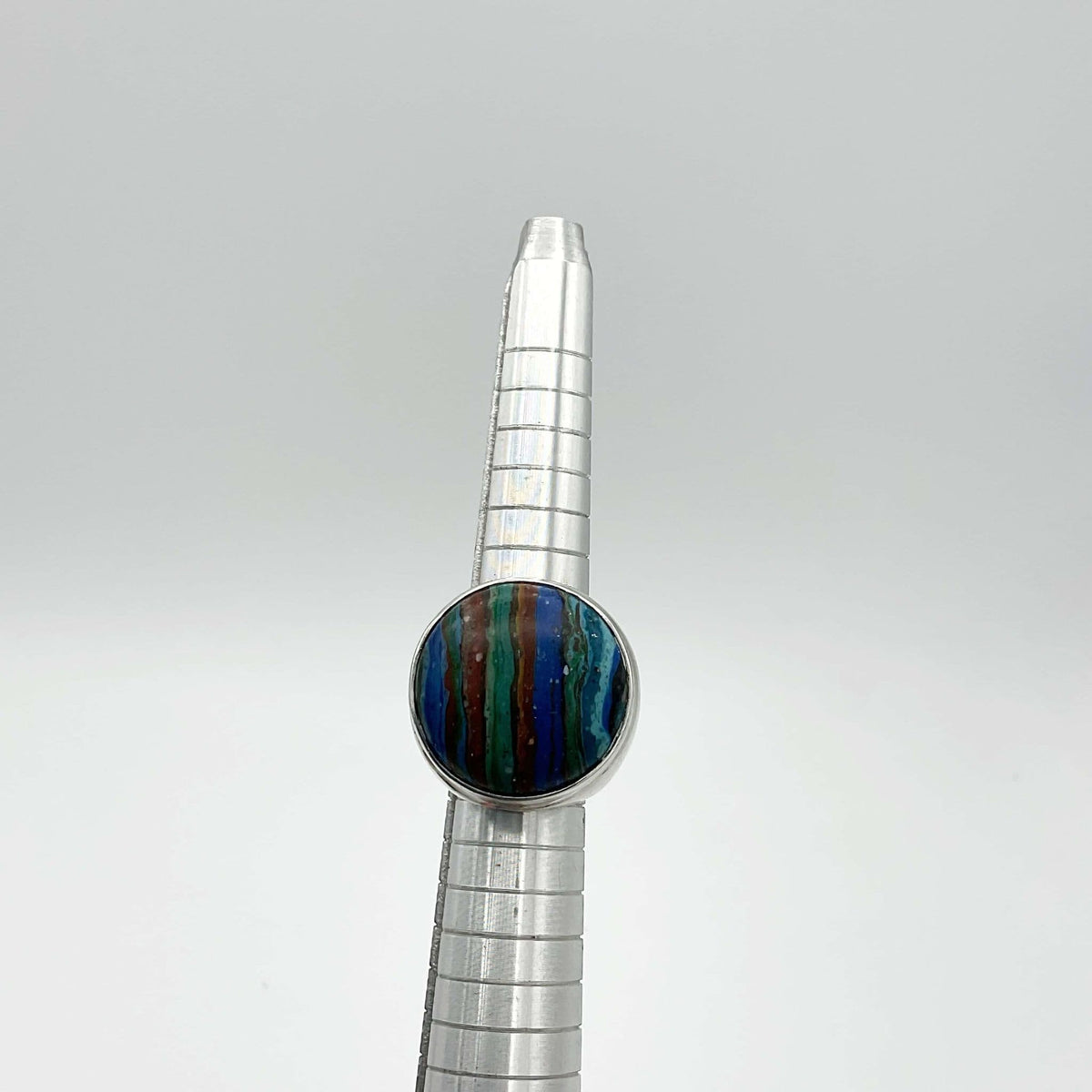 Multicoloured Rainbow Calsilica Silver Ring featuring vibrant rainbow hues and a polished silver band, designed by Beeches Vintage.