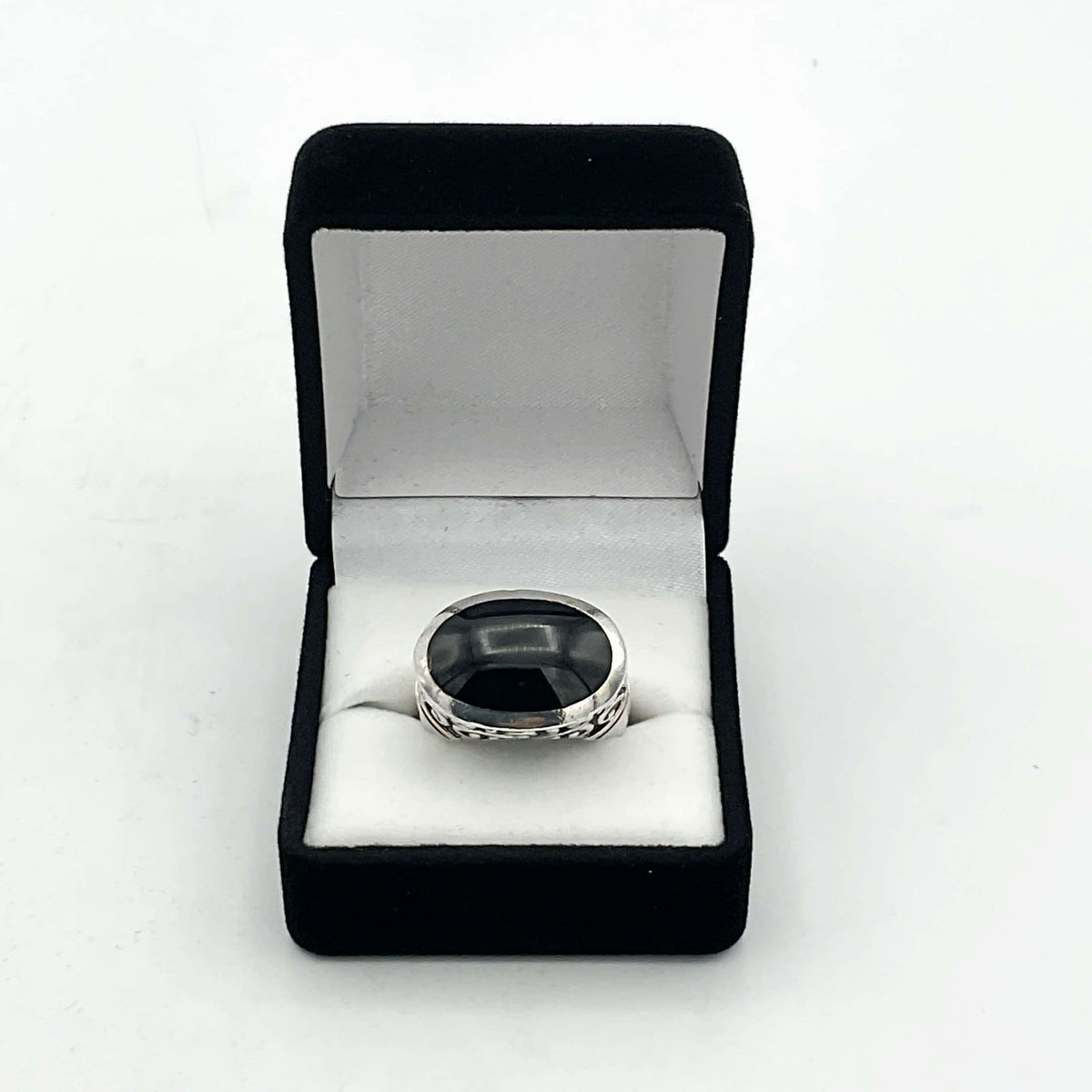 Oval black onyx silver ring by Beeches Vintage, featuring a polished black onyx stone set in a sleek silver band.