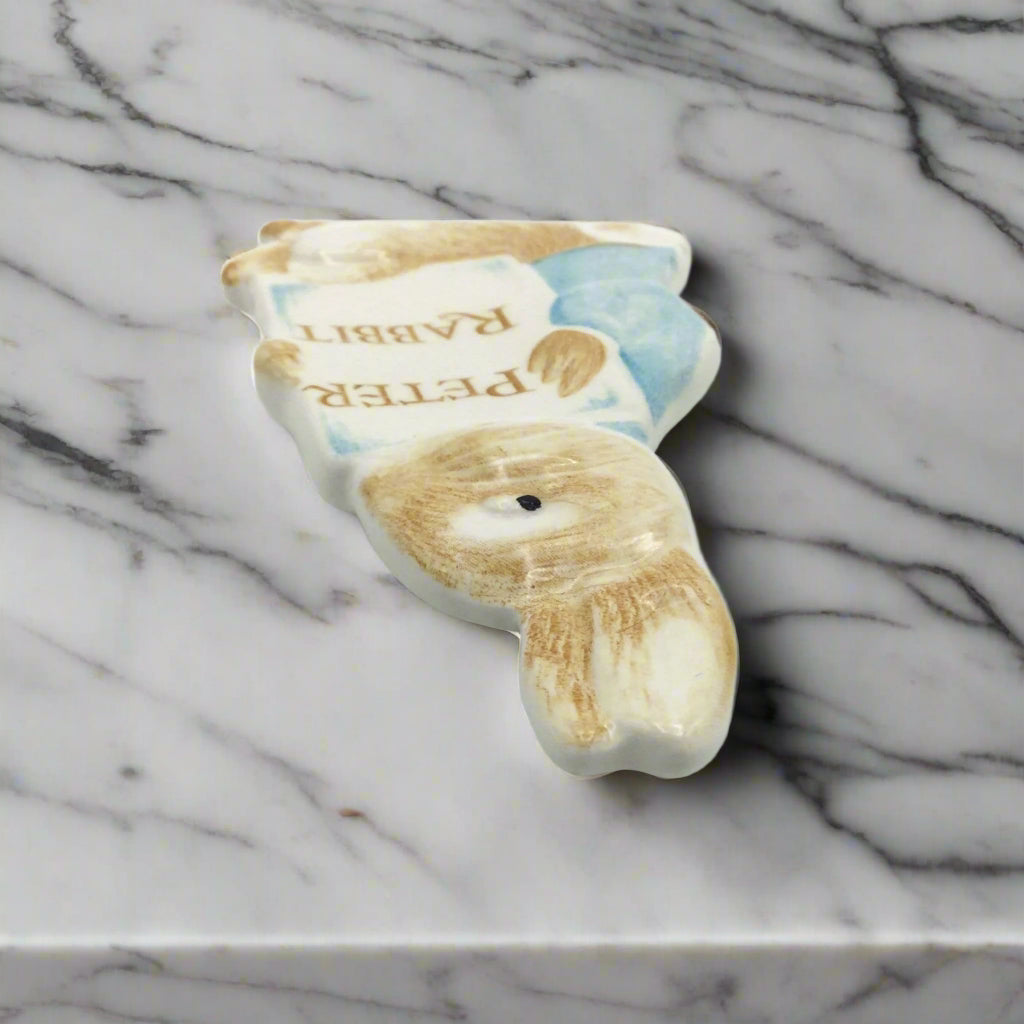 Peter Rabbit plaque viewed from top on a marble worktop