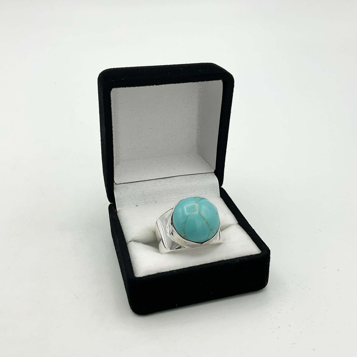 Polished turquoise silver ring from Beeches Vintage featuring a smooth, rounded turquoise stone set in a silver band.