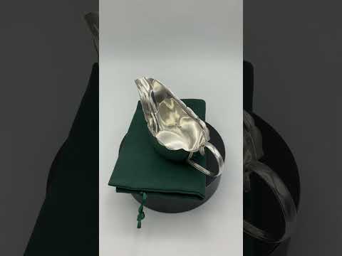 Video short of silver gravy boat on turntable