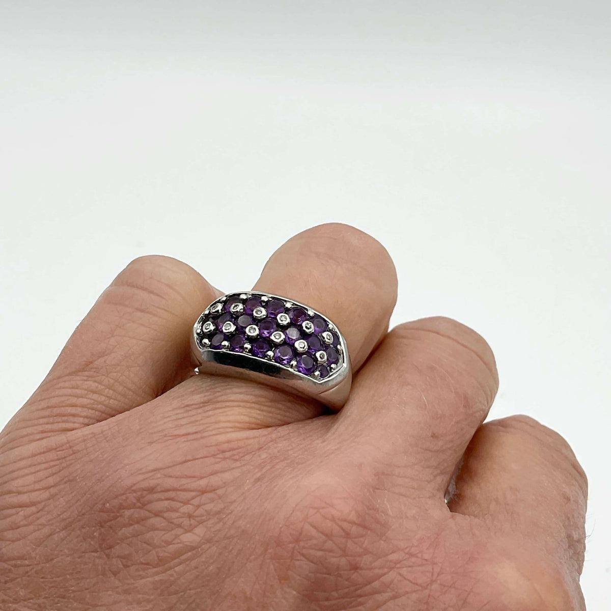 Purple Amethyst sterling silver ring with intricate band design from Beeches Vintage, showcasing a vibrant purple gemstone.
