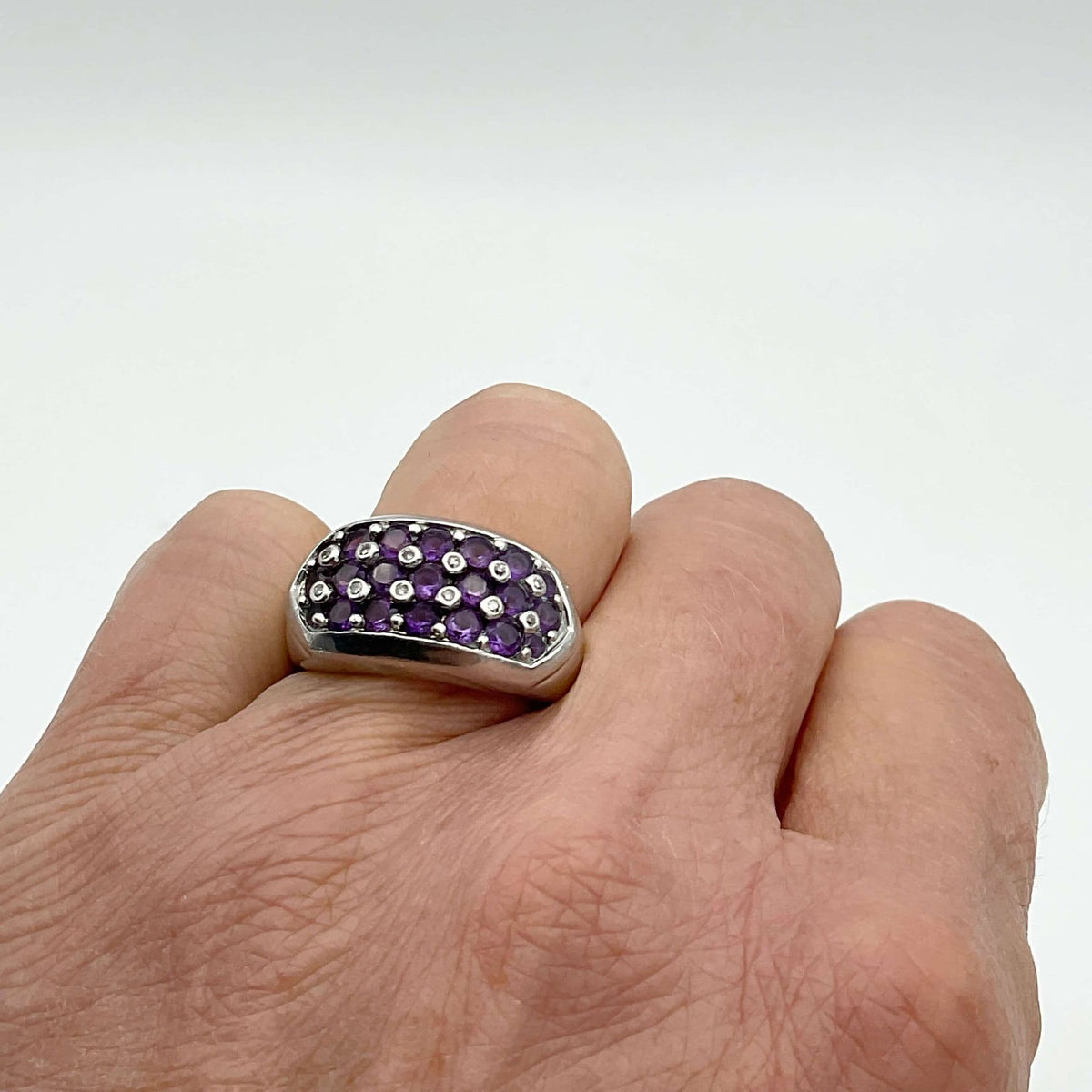 Purple Amethyst Sterling Silver Ring featuring a large oval amethyst gemstone set in a detailed silver band.