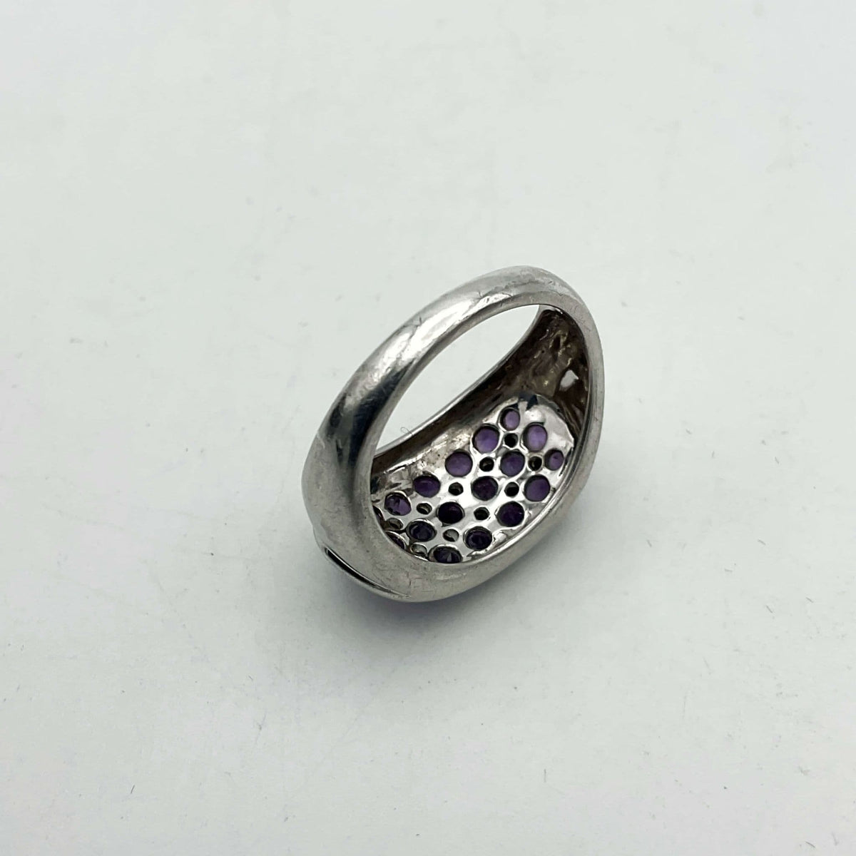 Purple Amethyst Sterling Silver Ring featuring a polished amethyst gemstone set in a detailed sterling silver band.