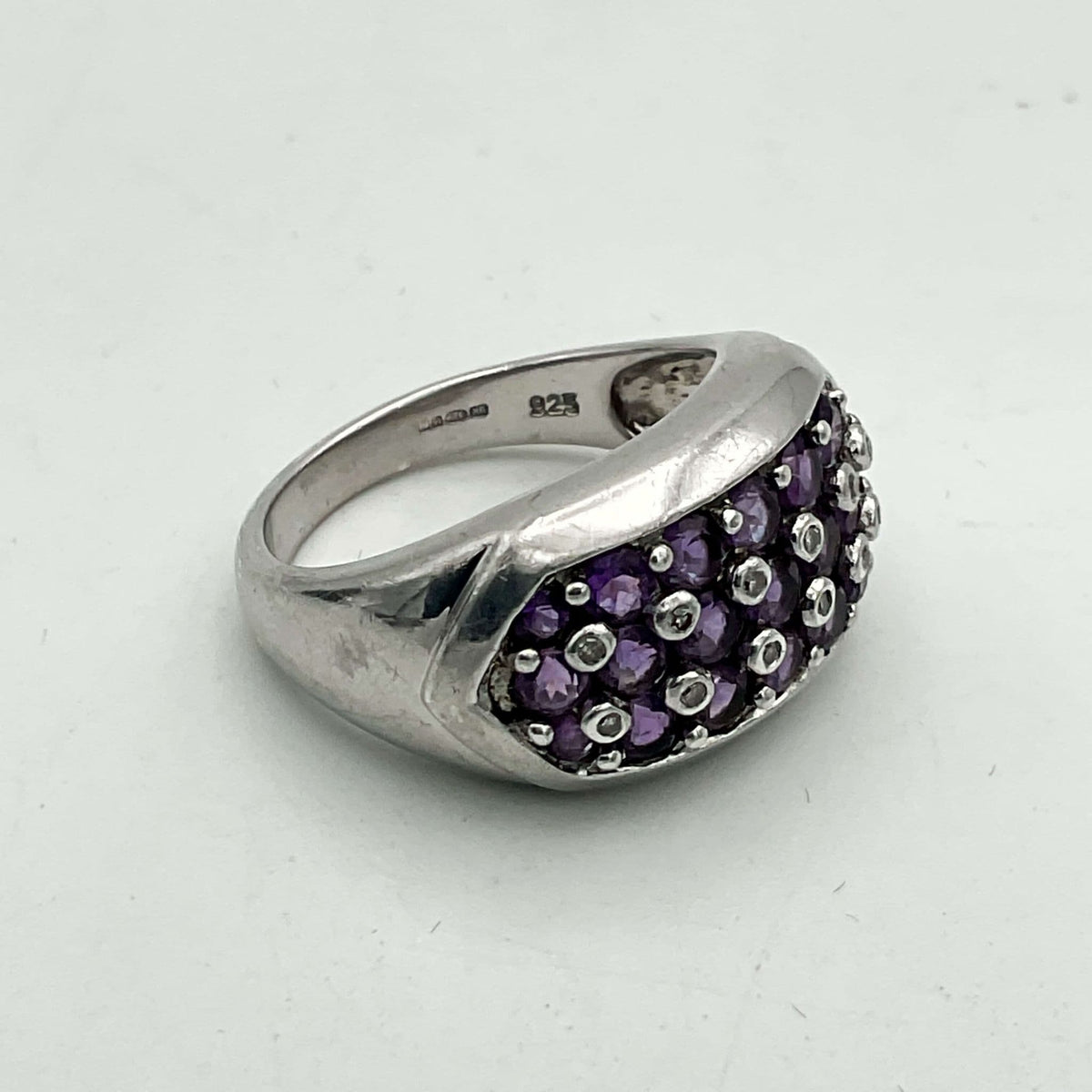 Purple Amethyst Sterling Silver Ring featuring a polished amethyst gemstone set in a detailed sterling silver band.