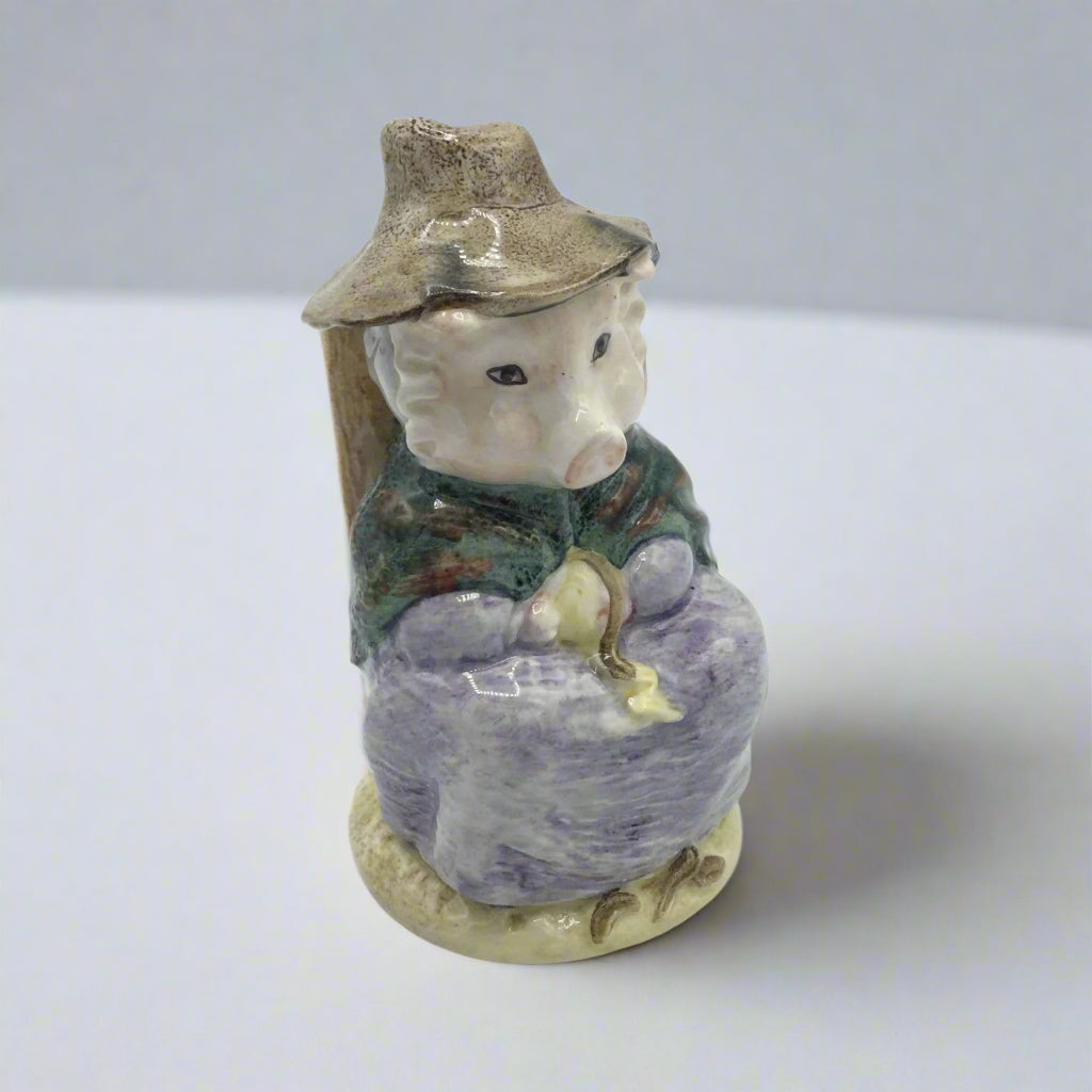 pig figurine on white table