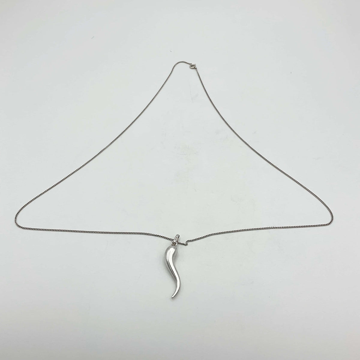 Silver drop pendant necklace by Beeches Vintage featuring a sleek, elegant silver teardrop charm on a delicate chain.