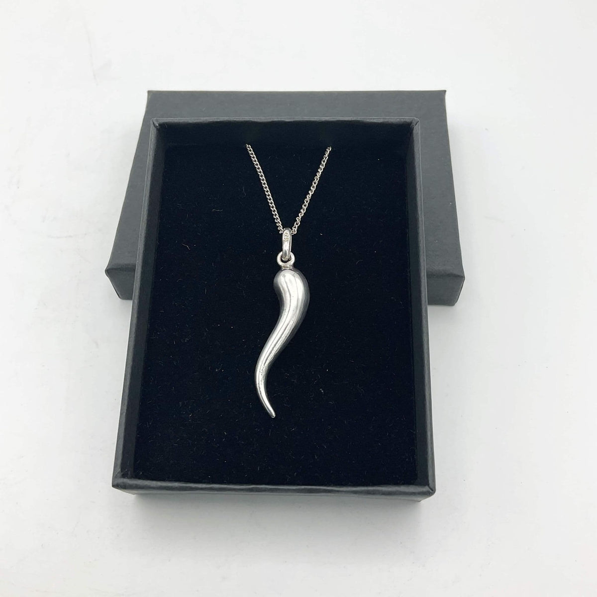Silver drop pendant necklace by Beeches Vintage featuring a sleek, elegant silver pendant on a delicate chain.