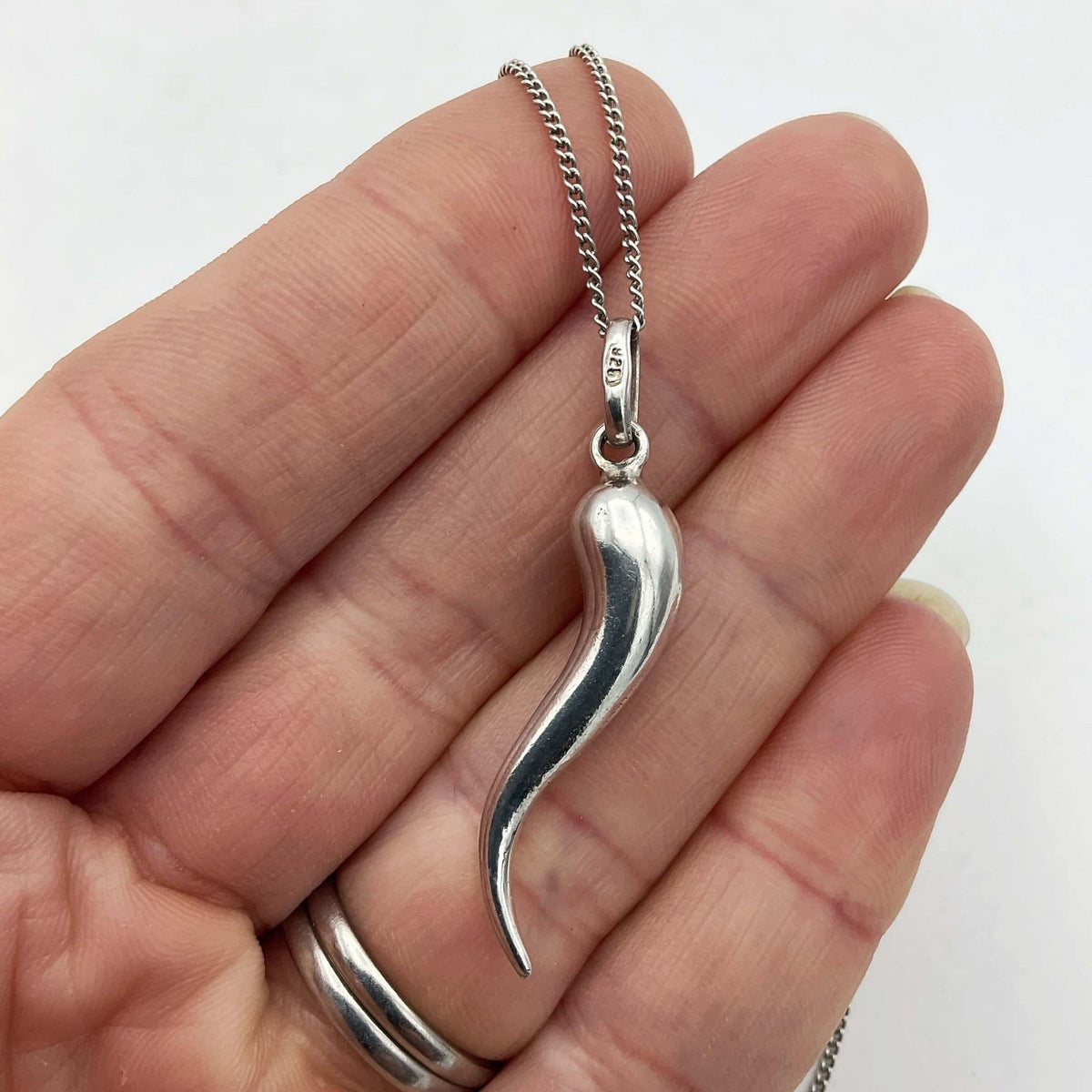 Silver drop pendant necklace from Beeches Vintage featuring a sleek, elegant silver pendant on a delicate chain.