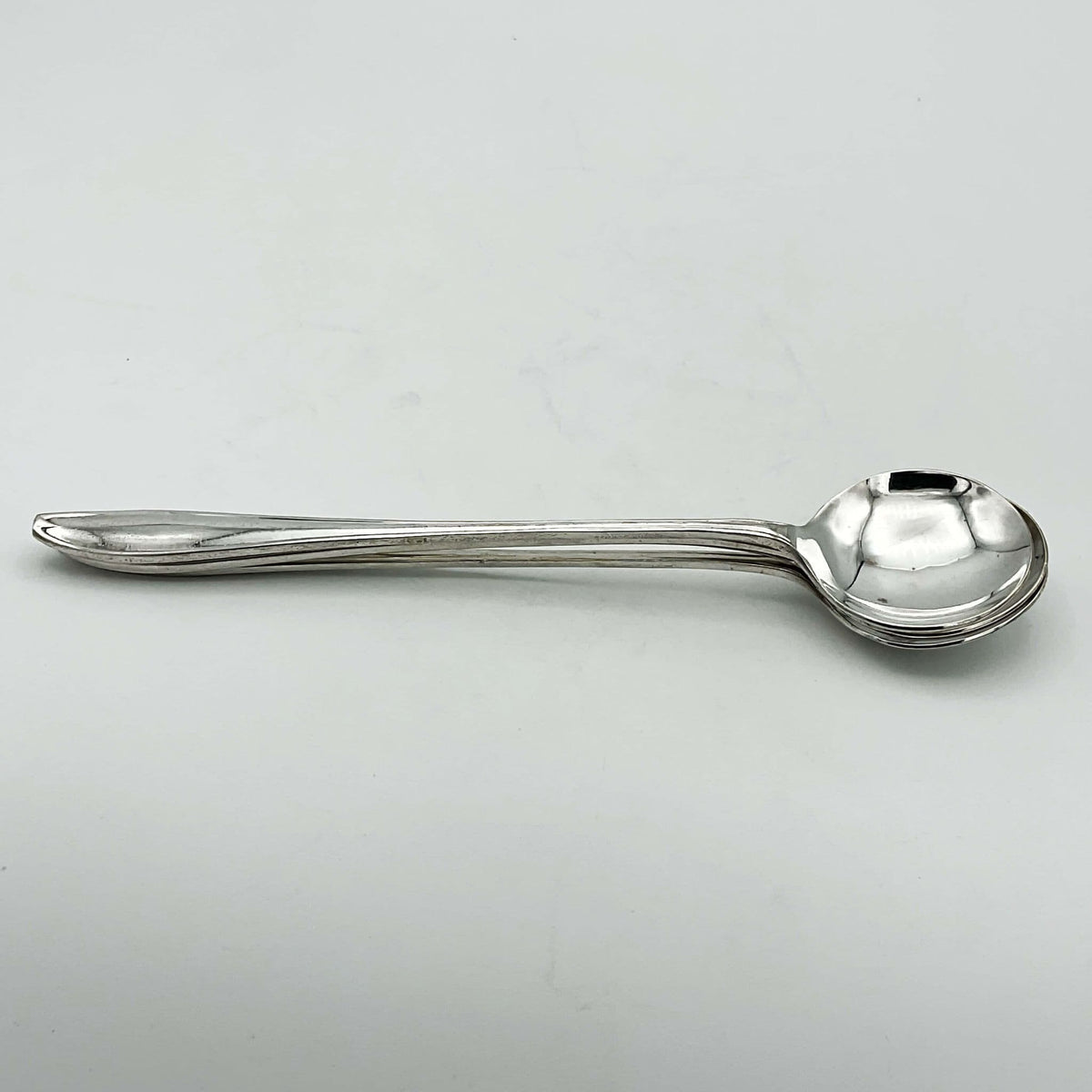 Set of silver-plated long-handled dessert spoons by Beeches Vintage, showcasing elegant reflective finish and classic design.