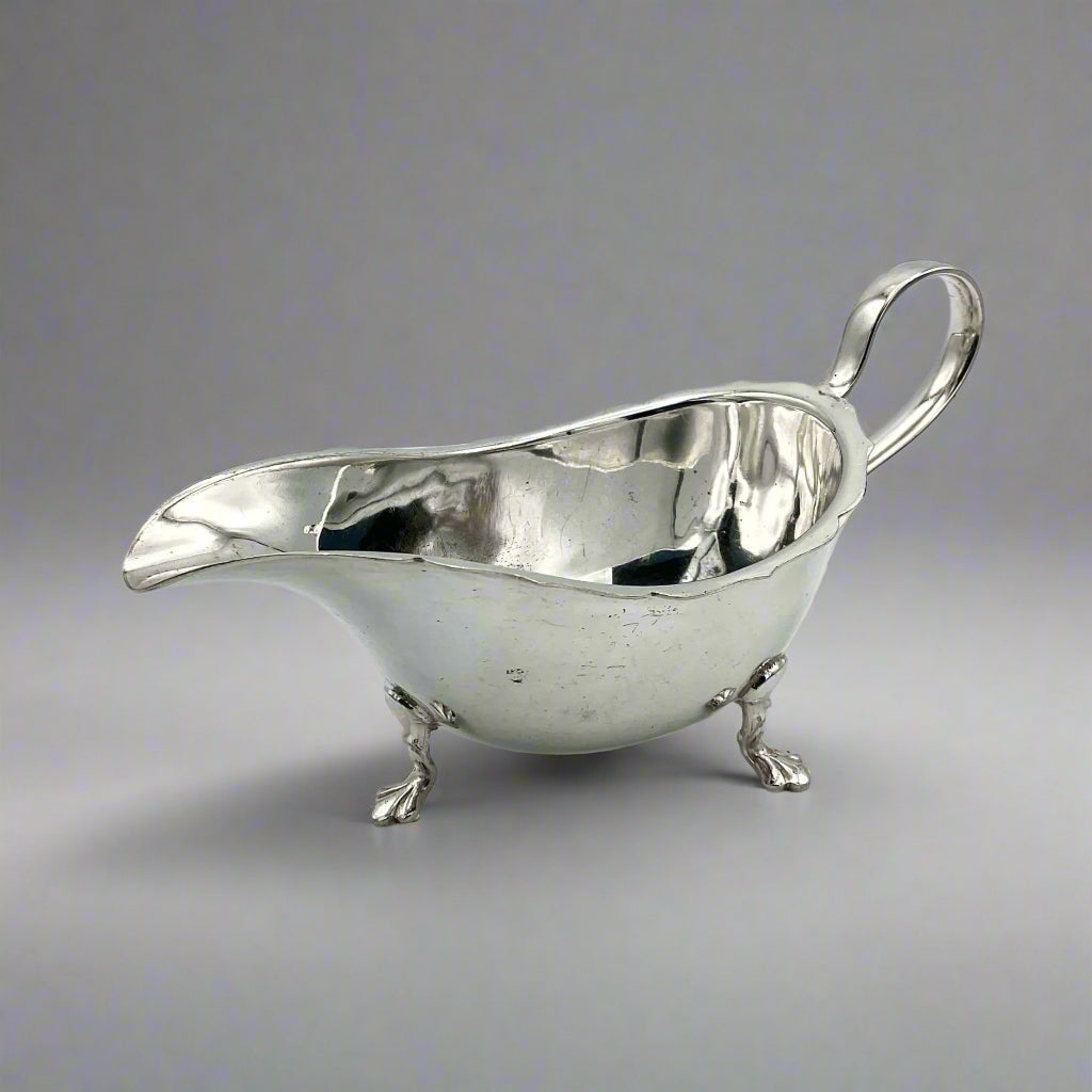 silver plated gravy boat on a light surface