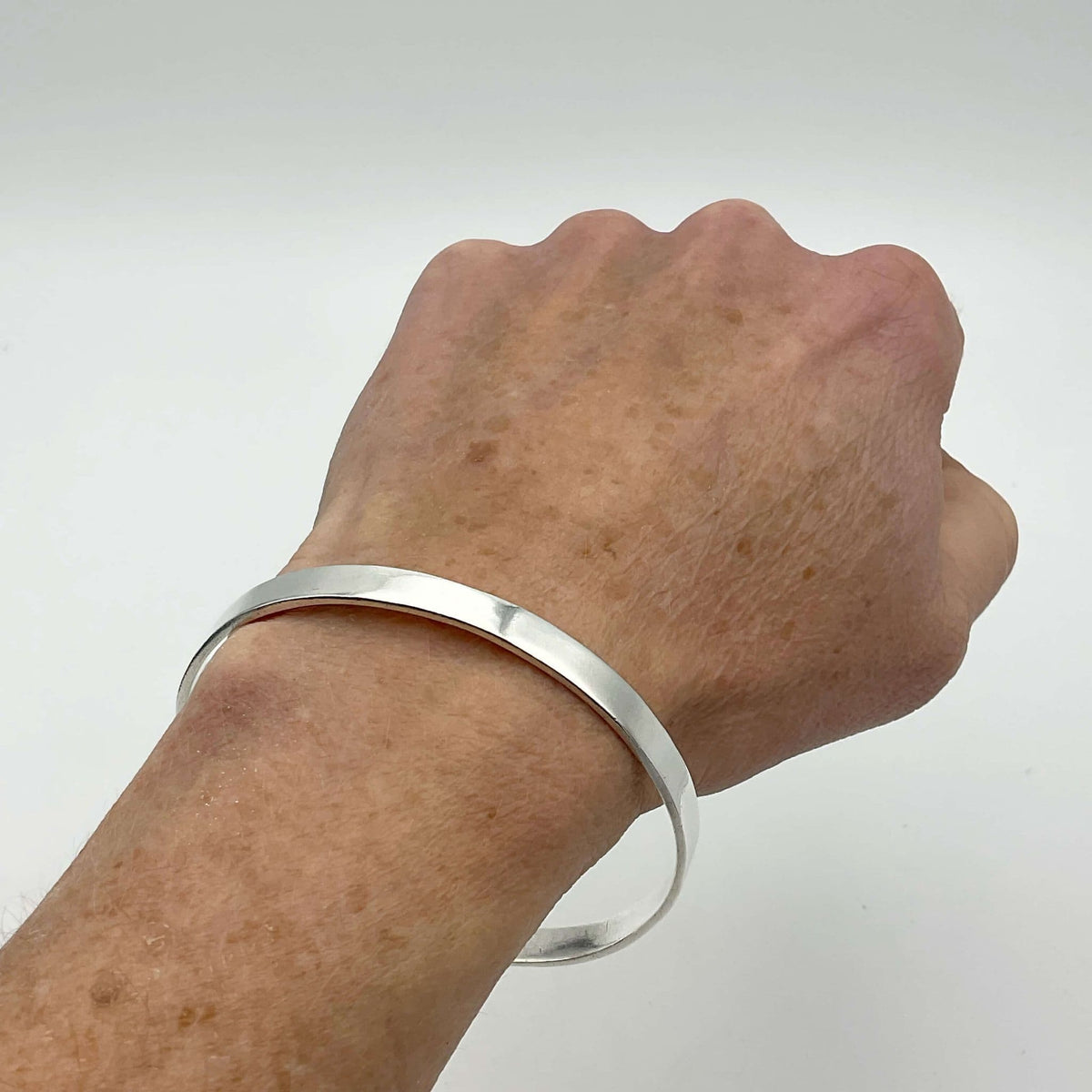 Sterling silver bangle bracelet by Beeches Vintage featuring a smooth, polished finish and classic design.