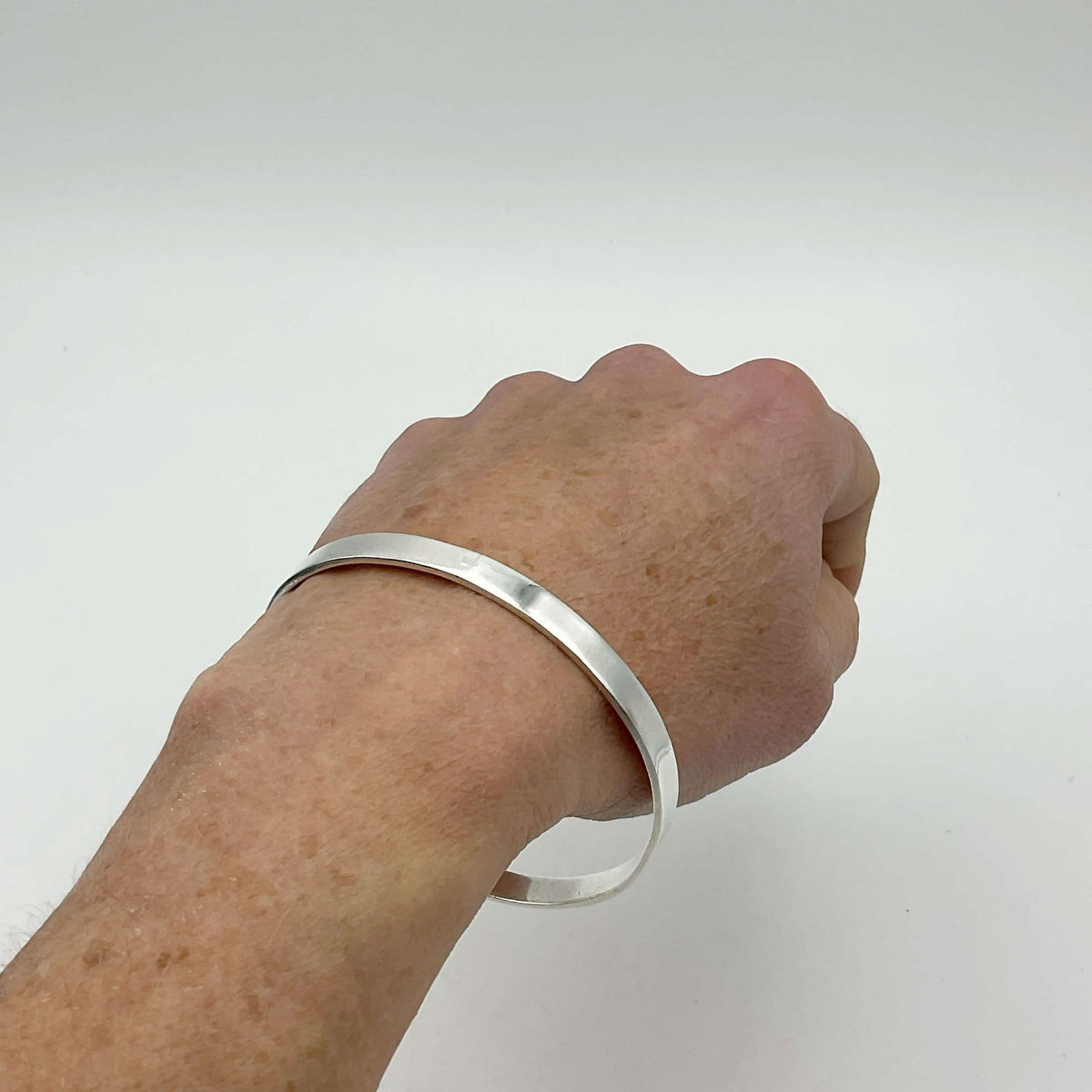 Sterling silver bangle bracelet by Beeches Vintage featuring a smooth, polished finish and classic design.