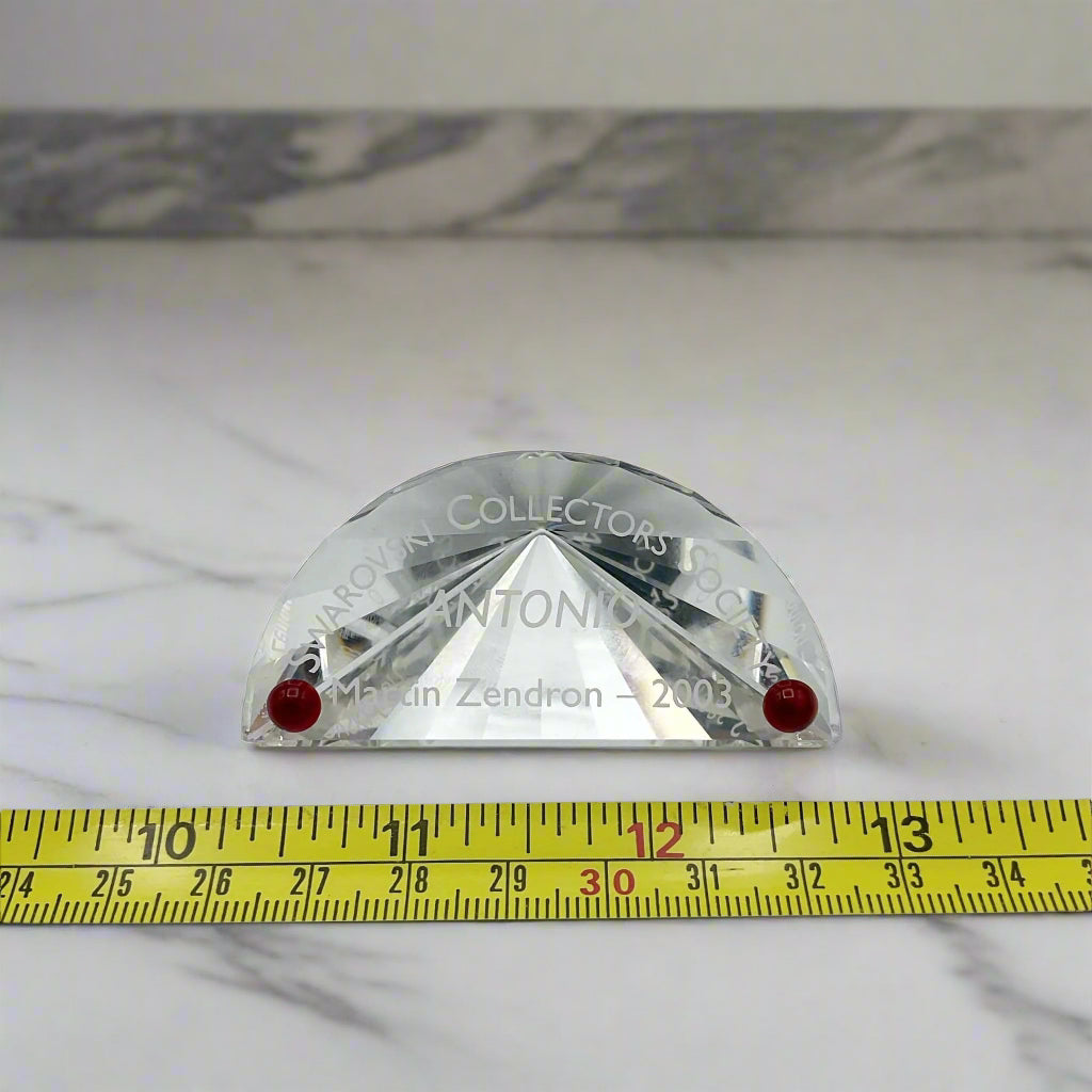 Swarovski Crystal Plaque next to a tape measure for scale on a marble worktop