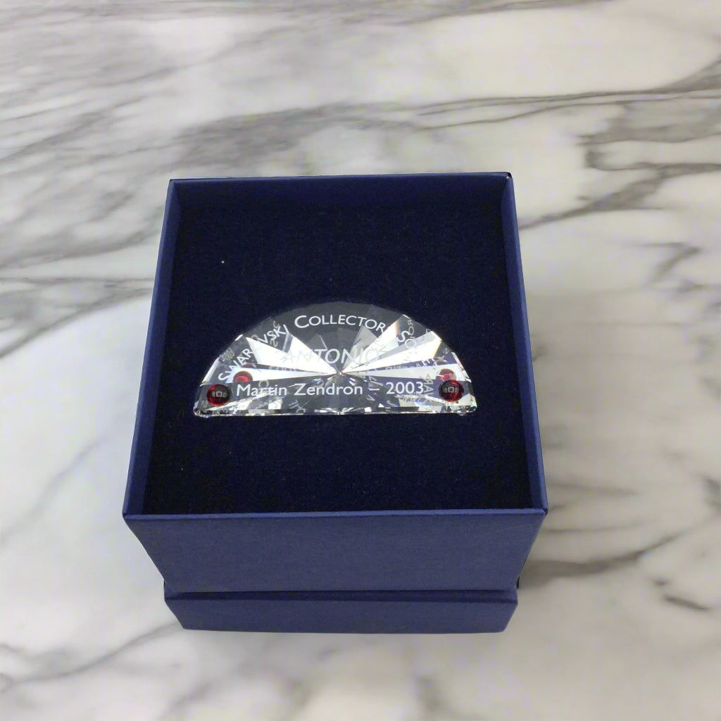 Swarovski Antonio plaque in a box on a marble worktop