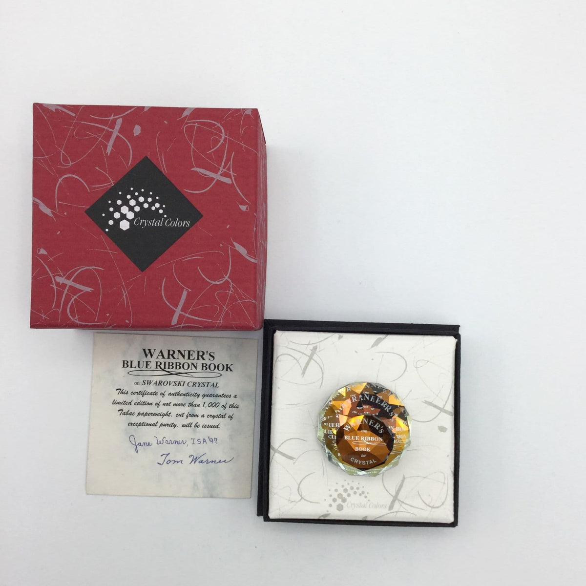Swarovski Crystal Orange Paperweight by Beeches Vintage, limited edition, featuring a sparkling orange crystal with intricate design.