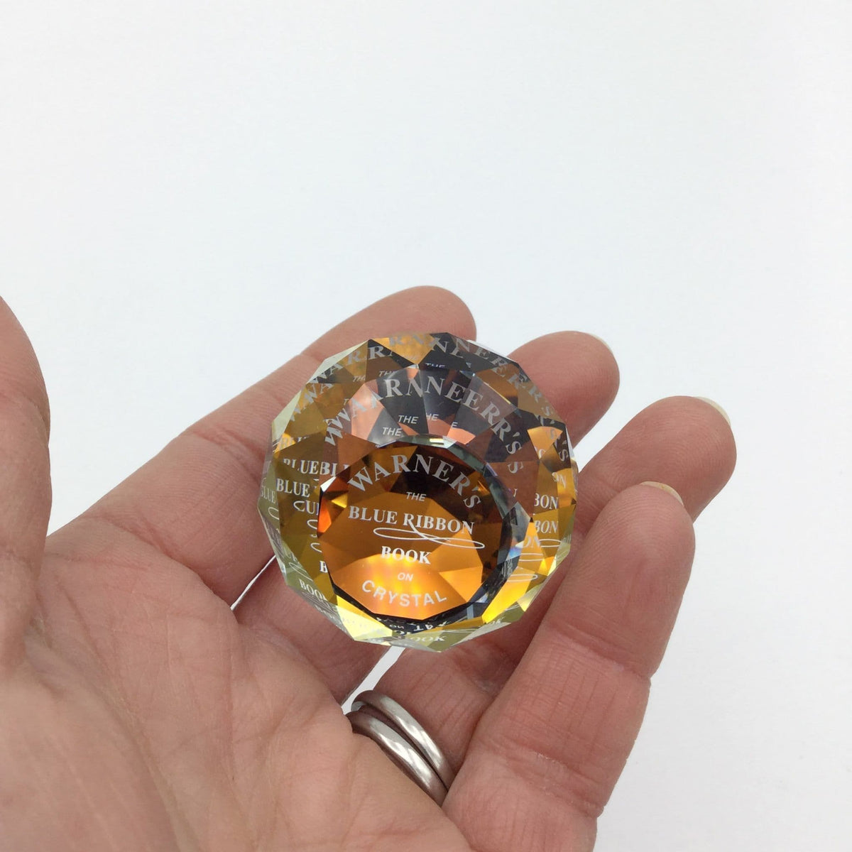 Swarovski crystal orange paperweight by Beeches Vintage, limited edition, with intricate faceted design and vibrant orange hue