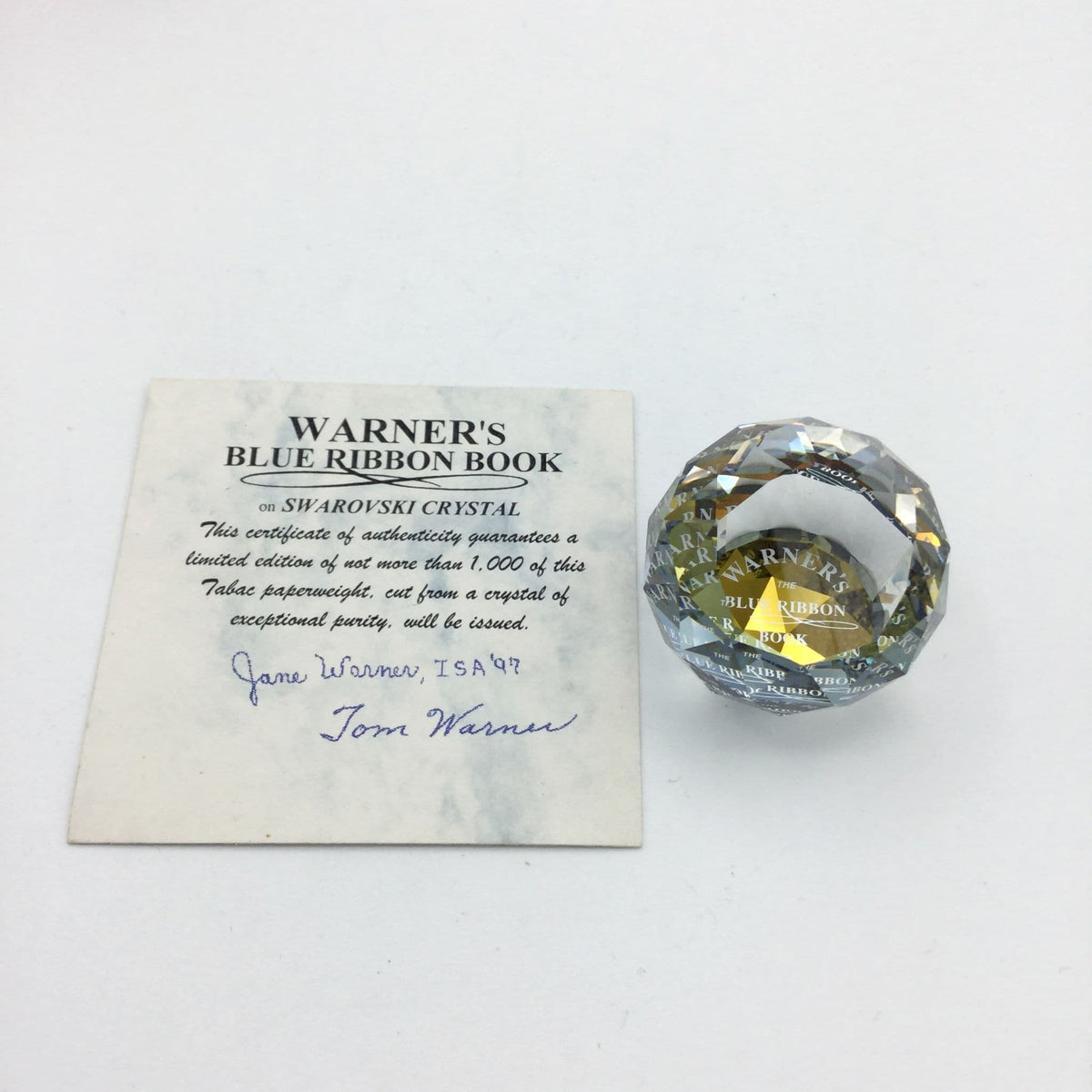 Swarovski Crystal orange limited edition paperweight with intricate faceted design, by Beeches Vintage.