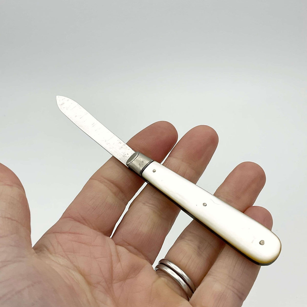 Vintage 1926 Beeches Vintage sterling silver fruit knife with mother-of-pearl handle and hallmarked details.