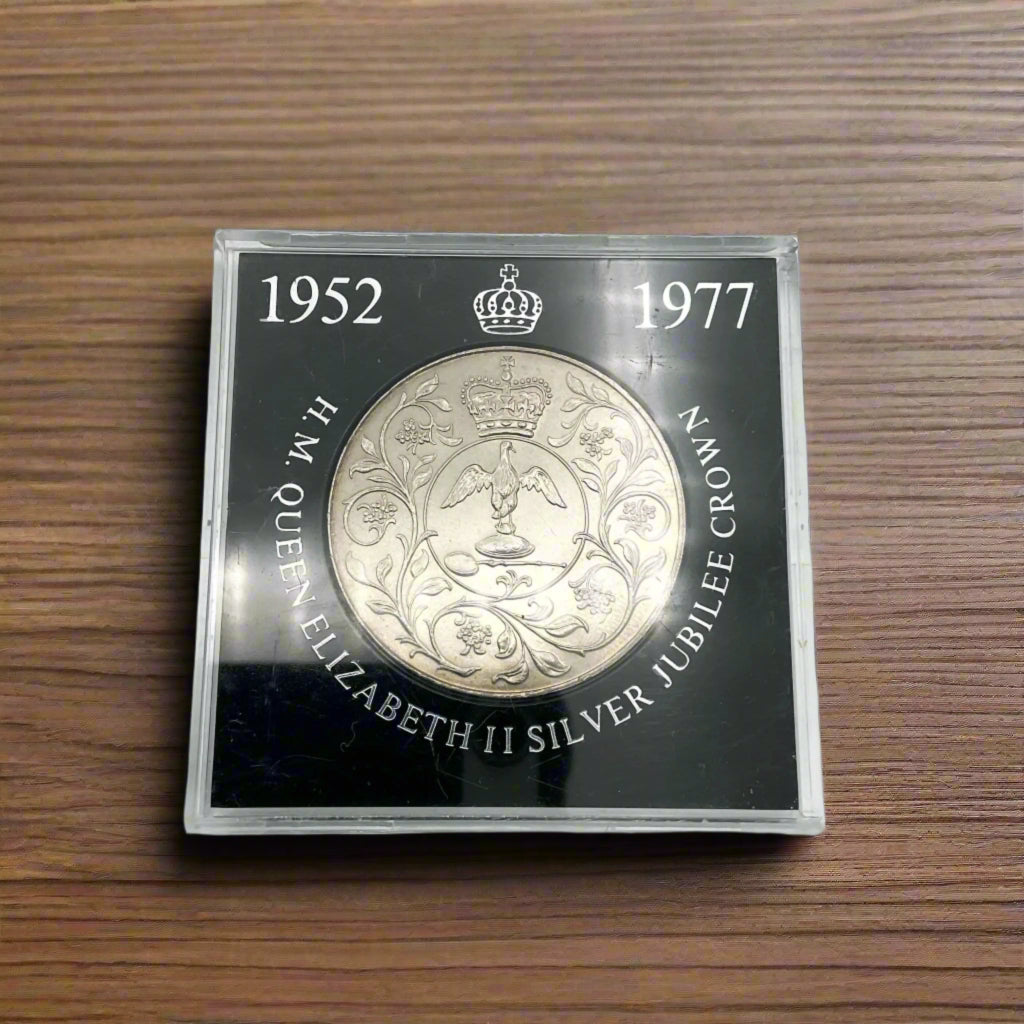 silver crown coin in a black case with HM Queen Elizabeth II Jubliee Crown